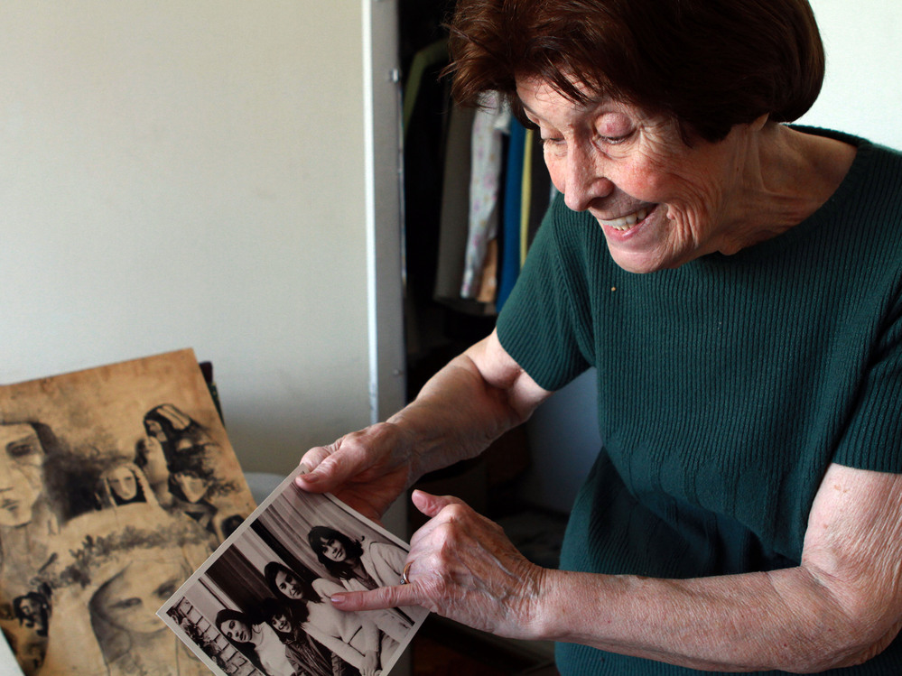 Elsa Sanchez de Oesterheld, 87, looks at pictures of her four daughters who were killed by the military dictatorship. Two of the daughters were pregnant when they were seized, but Oesterheld still does not know what happened to the babies.