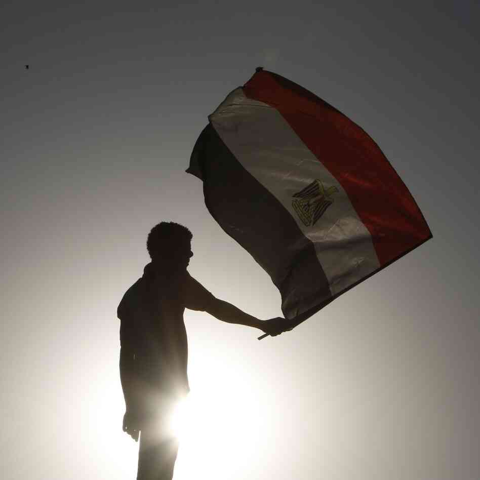 An Egyptian protester waves a flag in Cairo.