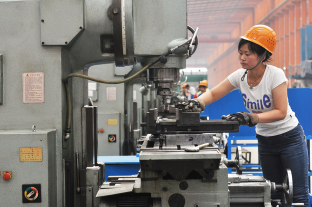 A Chinese worker operates a machine at a factory in Binzhou in northeast China's Shandong province. China's exports and imports shot up in May year-on-year, the customs agency said on June 10, defying expectations amid a slowdown in the world's second largest economy.