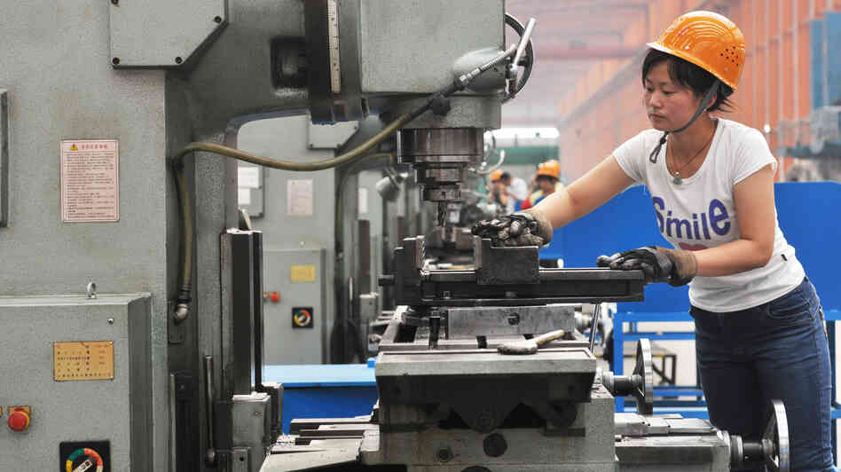 A Chinese worker operates a machine at a factory in Binzhou in northeast China's Shandong province. China's exports and imports shot up in May year-on-year, the customs agency said on June 10, defying expectations amid a slowdown in the world's second largest economy.