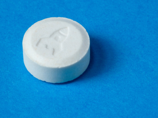 An ecstasy pill with a rocket shop imprint.