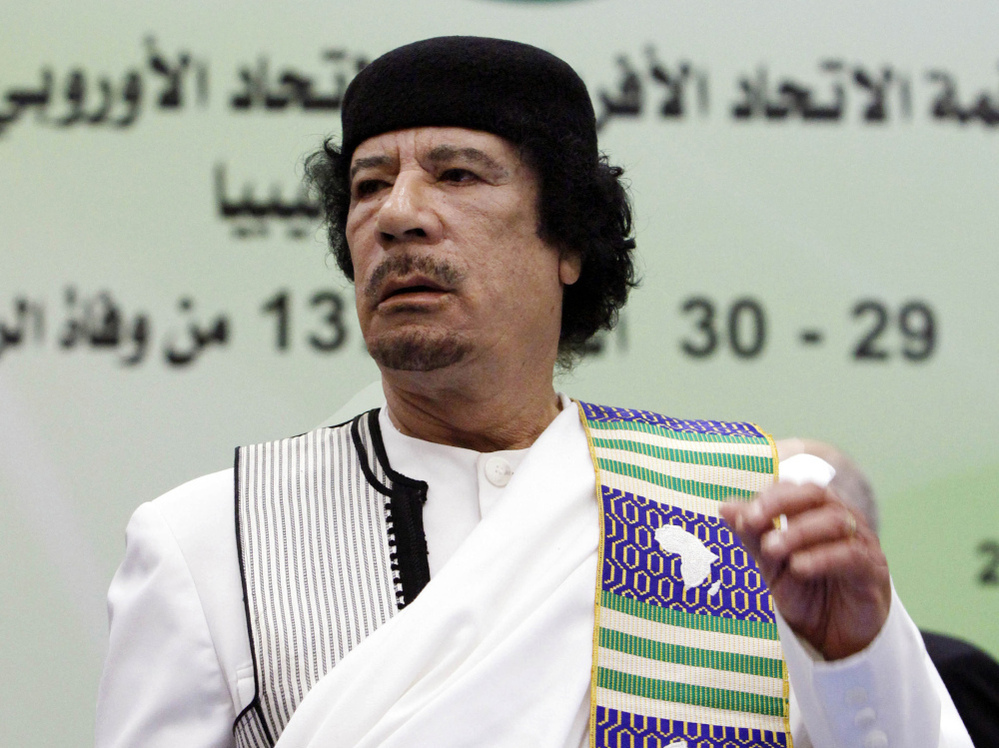 Libyan leader Moammar Gadhafi attends the opening session of the Africa-EU summit in November 2010, before the current conflict. Now that the U.S. military has intervened in Libya, many wonder what the endgame is.