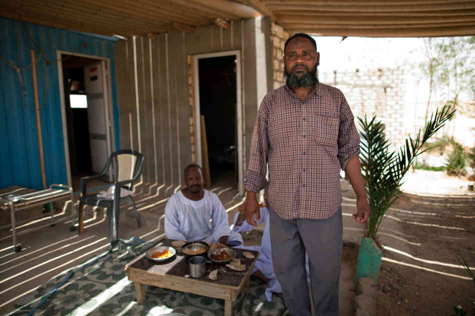 Fishing boat captain Adel Mohamed Hussein (right), at Sheikh Zayed Canal, is one of the few Egyptians who has benefited from the Toshka project.