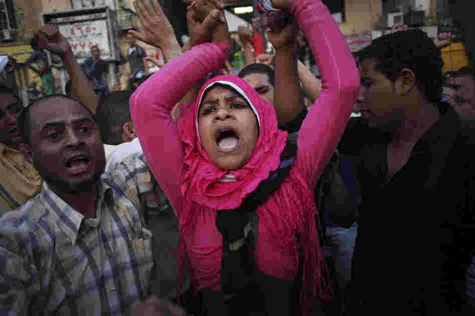 Egyptian protesters chant slogans against the country's military ruling council and presidential candidate Ahmed Shafiq in Tahrir Square in Cairo, Egypt on Thursday.