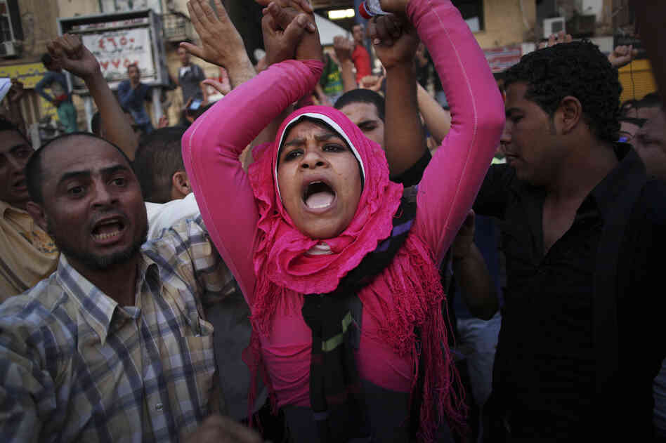 Egyptian protesters chant slogans against the country's military ruling council and presidential candidate Ahmed Shafiq in Tahrir Square in Cairo, Egypt on Thursday.
