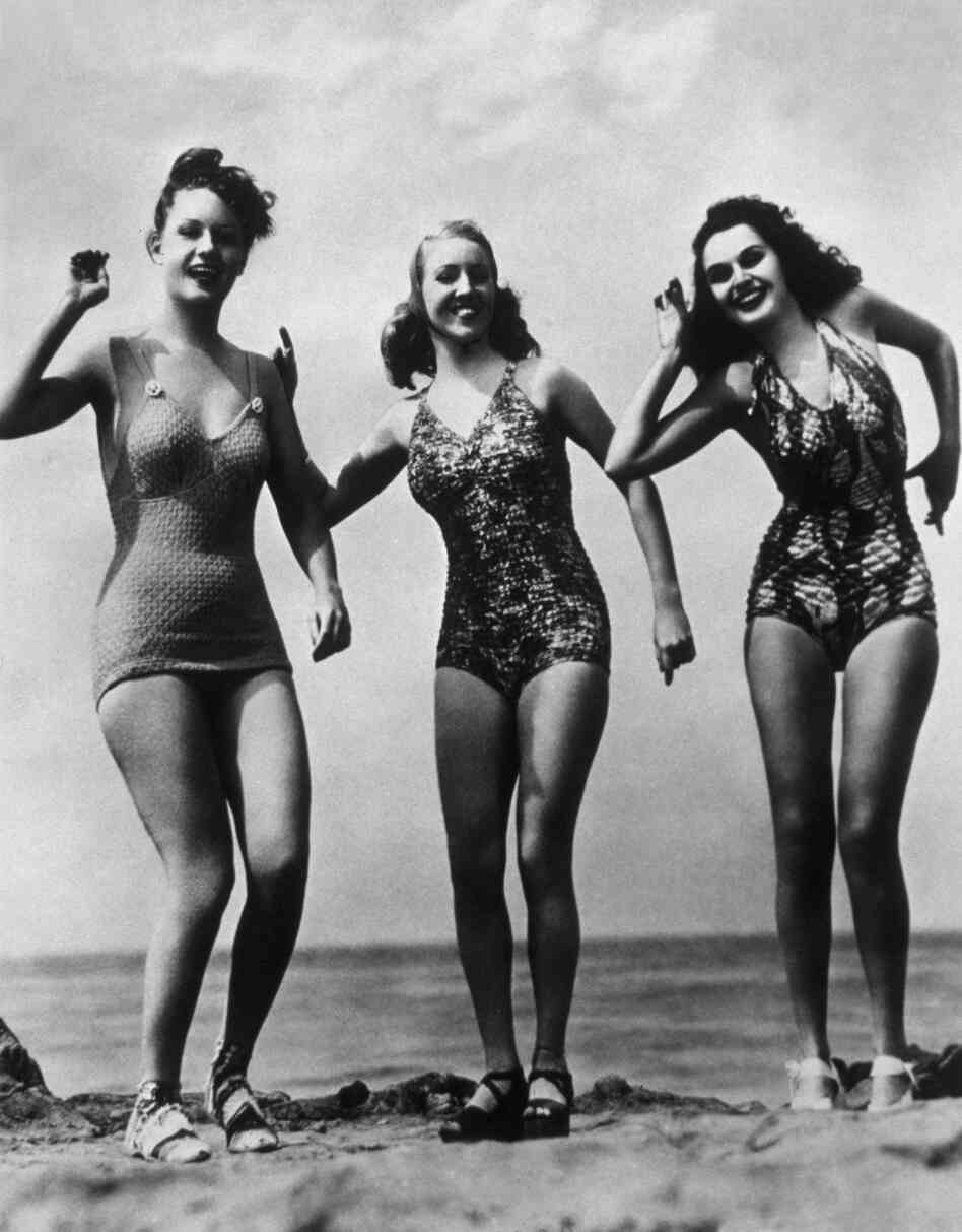 A trio at the beach, clad in state-of-the-art (in 1948) suits.