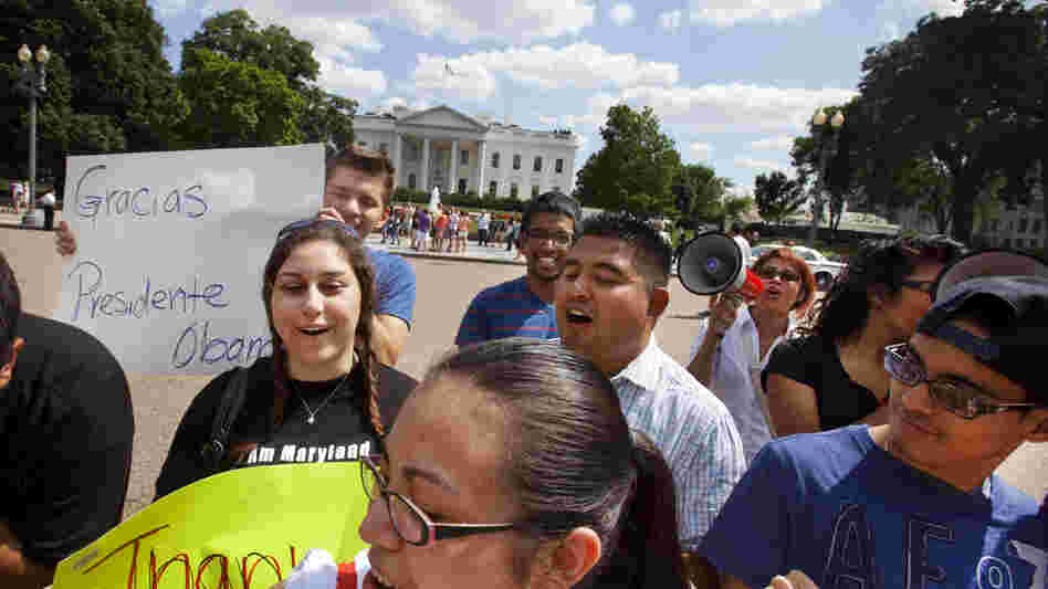 Supporters of President Obama's announcement on immigration policy rally outside the White House Friday.