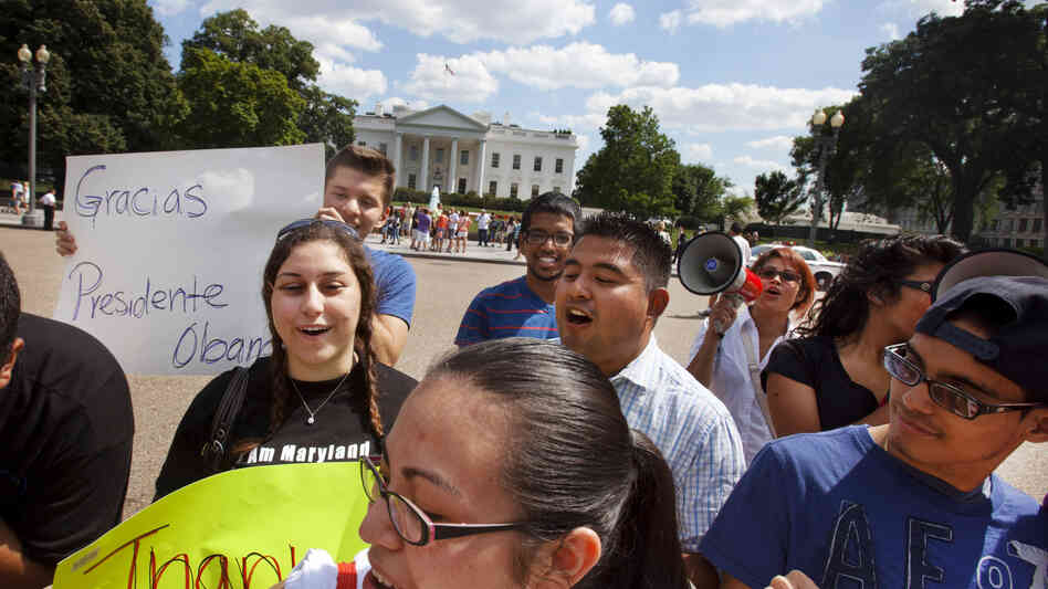 Supporters of President Obama's announcement on immigration policy rally outside the White House Friday.