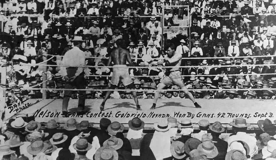 Joe Gans, left, defends his boxing title in 42 brutal rounds against Oscar "Battling" Nelson in Goldfield, Nev., on Sept. 3, 1906. Joe Gans, left, defends his boxing title in 42 brutal rounds against Oscar "Battling" Nelson in Goldfield, Nev., on Sept. 3, 1906.