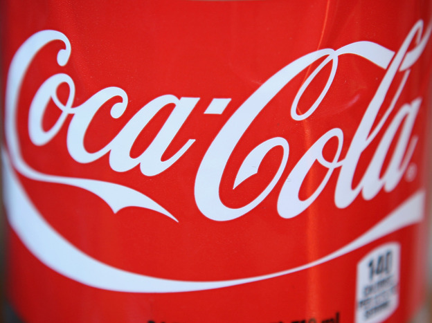 The Coca-Cola logo on a 24-ounce bottle.