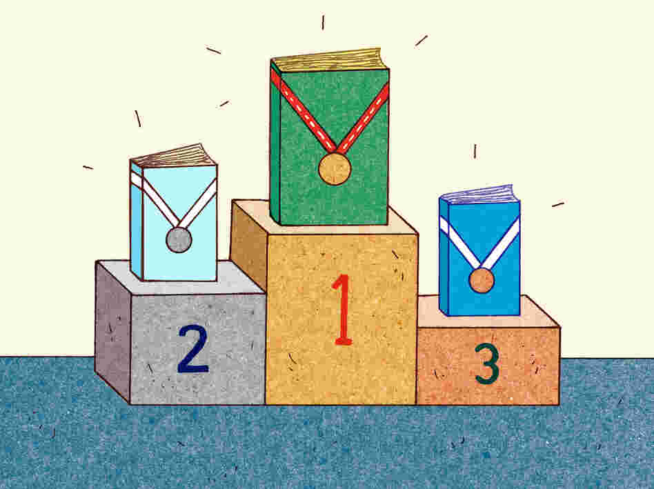 Three books with medals stand on a podium. Three books with medals stand on a podium.