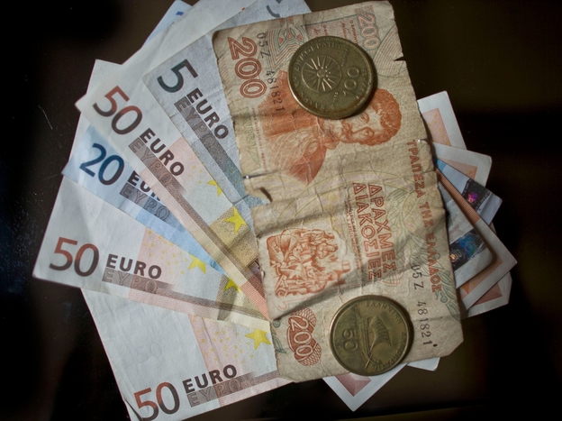 Drachma and Euro currency are displayed on June 13 in Athens, Greece. The Greek electorate are due to go to the polls on June 17 in a re-run of the general election after no combination of political parties were able to form a coalition government.