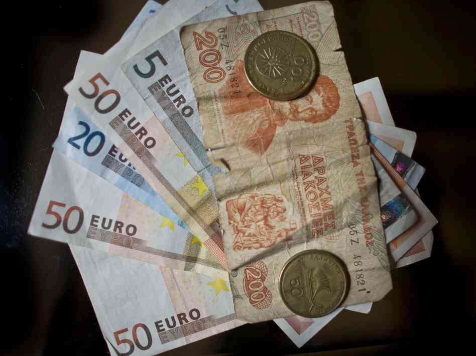 Drachma and Euro currency are displayed on June 13 in Athens, Greece. The Greek electorate are due to go to the polls on June 17 in a re-run of the general election after no combination of political parties were able to form a coalition government.