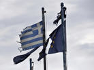 Torn Greek (left) and European Union flags fly at the entrance of an abandoned factory in the industrial zone of Komotini about 500 miles from Athens. Sunday's parliamentary election will go a long way toward determining whether Greece stays in the EU. Torn Greek (left) and European Union flags fly at the entrance of an abandoned factory in the industrial zone of Komotini about 500 miles from Athens. Sunday's parliamentary election will go a long way toward determining whether Greece stays in the EU.