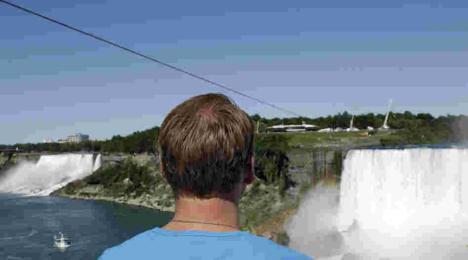 Nik Wallenda looks at the tightrope cable in Niagara Falls, Canada on Wednesday.