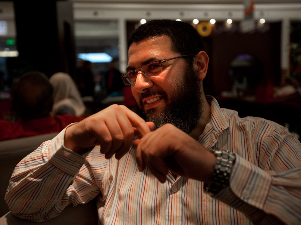 Tolba sports a bushy beard — a marker of religious conservatives — yet also wears Western-style jeans. He says he doesn't agree with all aspects of modern life in Egypt, yet he knows he cannot change things overnight.