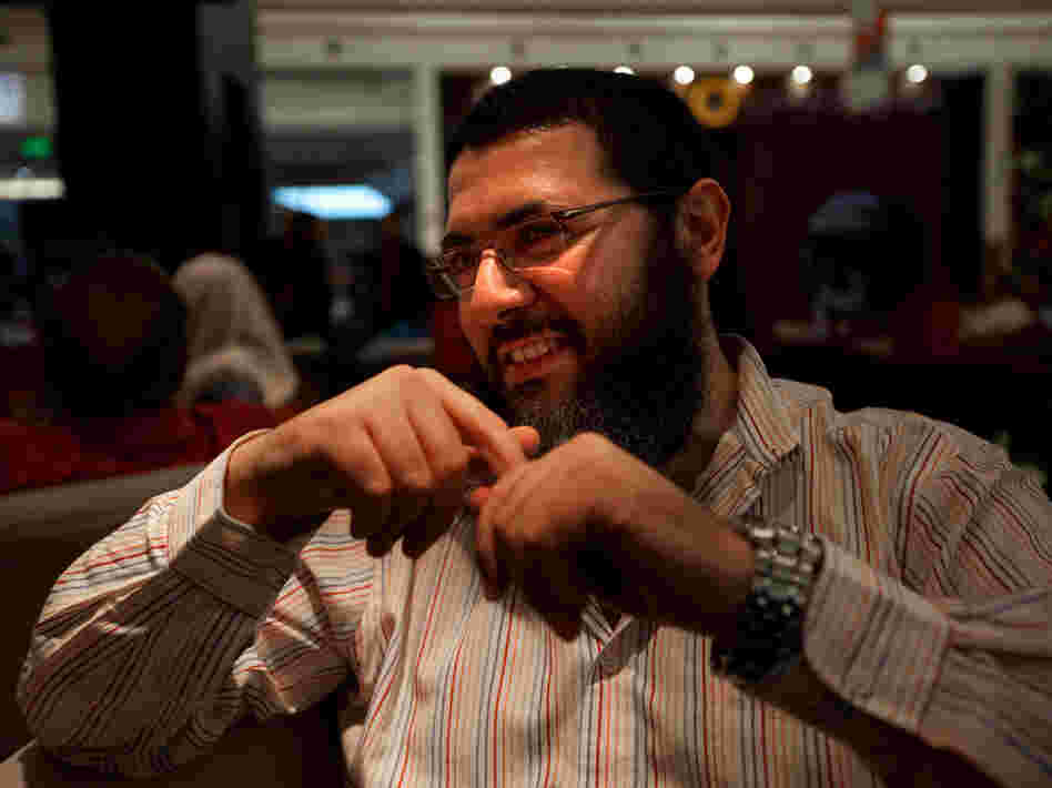 Tolba sports a bushy beard — a marker of religious conservatives — yet also wears Western-style jeans. He says he doesn't agree with all aspects of modern life in Egypt, yet he knows he cannot change things overnight.