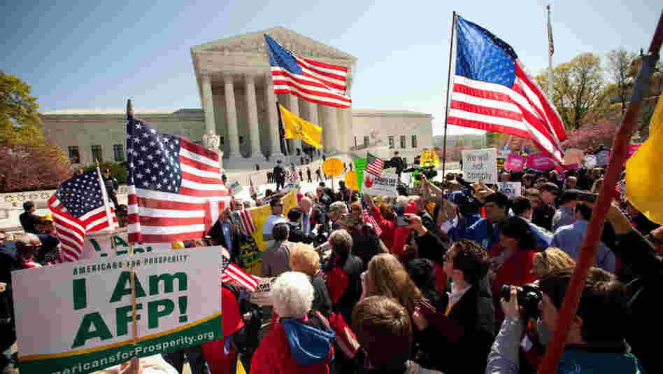 Demonstrators both for and against the health care law turned out on the steps of the Supreme Court on March 27, the second day of oral arguments before the court. Demonstrators both for and against the health care law turned out on the steps of the Supreme Court on March 27, the second day of oral arguments before the court.