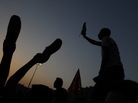 Egyptian anti-military protesters waved their shoes — a way of showing their extreme anger — as they demonstrated in Cairo's Tahrir Square on Thursday. More protests are planned for today. Egyptian anti-military protesters waved their shoes — a way of showing their extreme anger — as they demonstrated in Cairo's Tahrir Square on Thursday. More protests are planned for today.