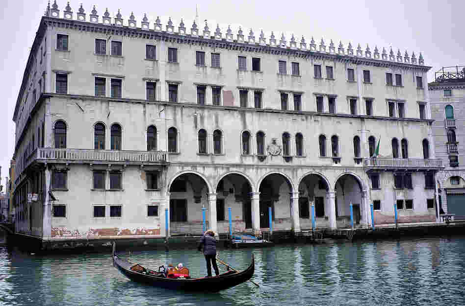 A gondola sails in front of the Fondaco dei Tedeschi, which has been sold to Benetton Group. The clothing company plans to convert the Venice landmark into a shopping mall. A gondola sails in front of the Fondaco dei Tedeschi, which has been sold to Benetton Group. The clothing company plans to convert the Venice landmark into a shopping mall.