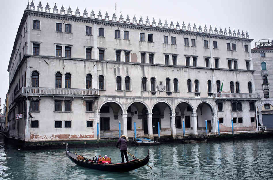 A gondola sails in front of the Fondaco dei Tedeschi, which has been sold to Benetton Group. The clothing company plans to convert the Venice landmark into a shopping mall. A gondola sails in front of the Fondaco dei Tedeschi, which has been sold to Benetton Group. The clothing company plans to convert the Venice landmark into a shopping mall.