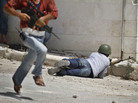 A Free Syrian Army fighter fires his weapon during clashes with Syrian troops near Idlib, Syria, on Friday. The U.N. said Saturday it is suspending its mission in Syria because of escalating violence. A Free Syrian Army fighter fires his weapon during clashes with Syrian troops near Idlib, Syria, on Friday. The U.N. said Saturday it is suspending its mission in Syria because of escalating violence.