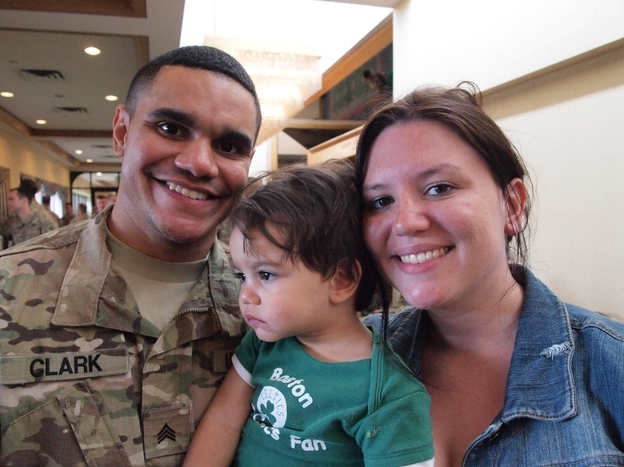 Sgt. Michael Clark and his fiancee, Kaitlin Forant, hold their son, Michael Clark Jr. It took time for the 18-month-old to recognize his father after Clark's deployment.