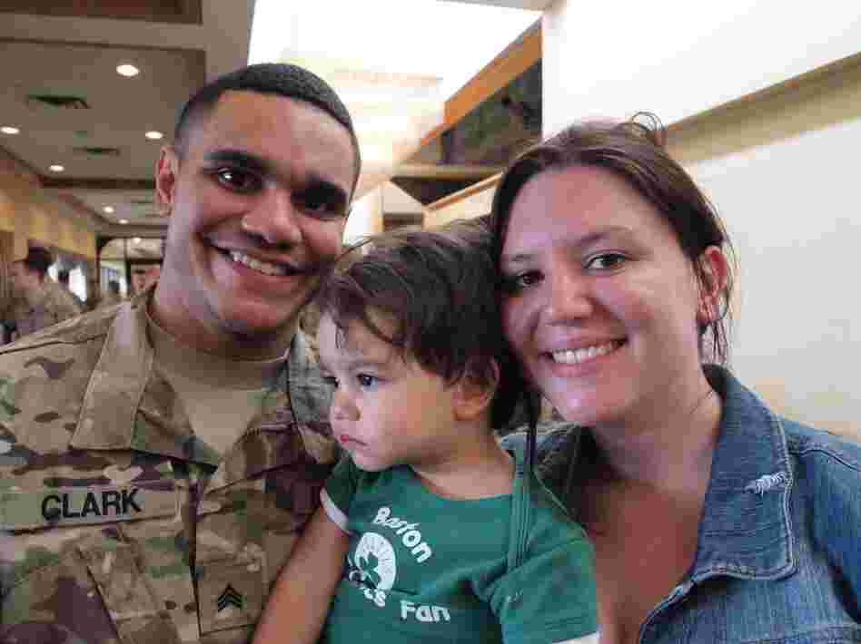 Sgt. Michael Clark and his fiancee, Kaitlin Forant, hold their son, Michael Clark Jr. It took time for the 18-month-old to recognize his father after Clark's deployment.