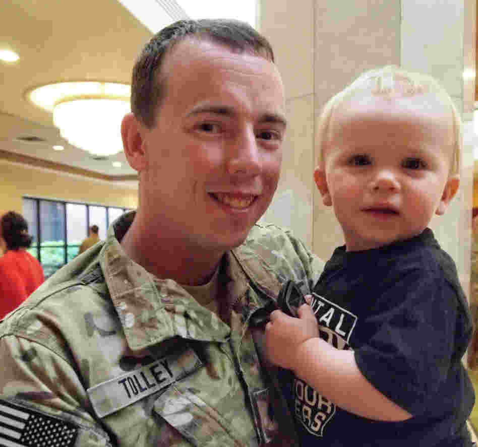Spc. Bryan Tolley and his 18-month-old son, Ryan. Tolley says that while deployed he would see children that reminded him of Ryan and immediately call home.
