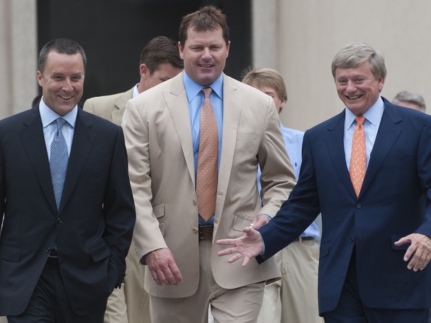 Former pitcher Roger Clemens, center, and his attorneys Rusty Hardin, right, and Michael Attanasio arrive on the courthouse steps after Clemens was found not guilty on all charges in his perjury trial at U.S. District Court in Washington, D.C., on Monday.