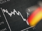 Frankfurt: A German flag hung today in front of a board displaying the DAX stock index. Frankfurt: A German flag hung today in front of a board displaying the DAX stock index.