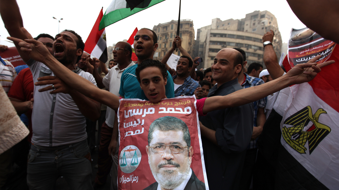 Supporters of Muslim Brotherhood candidate Mohammed Mursi (in portrait) celebrated today in Cairo's Tahrir Square.