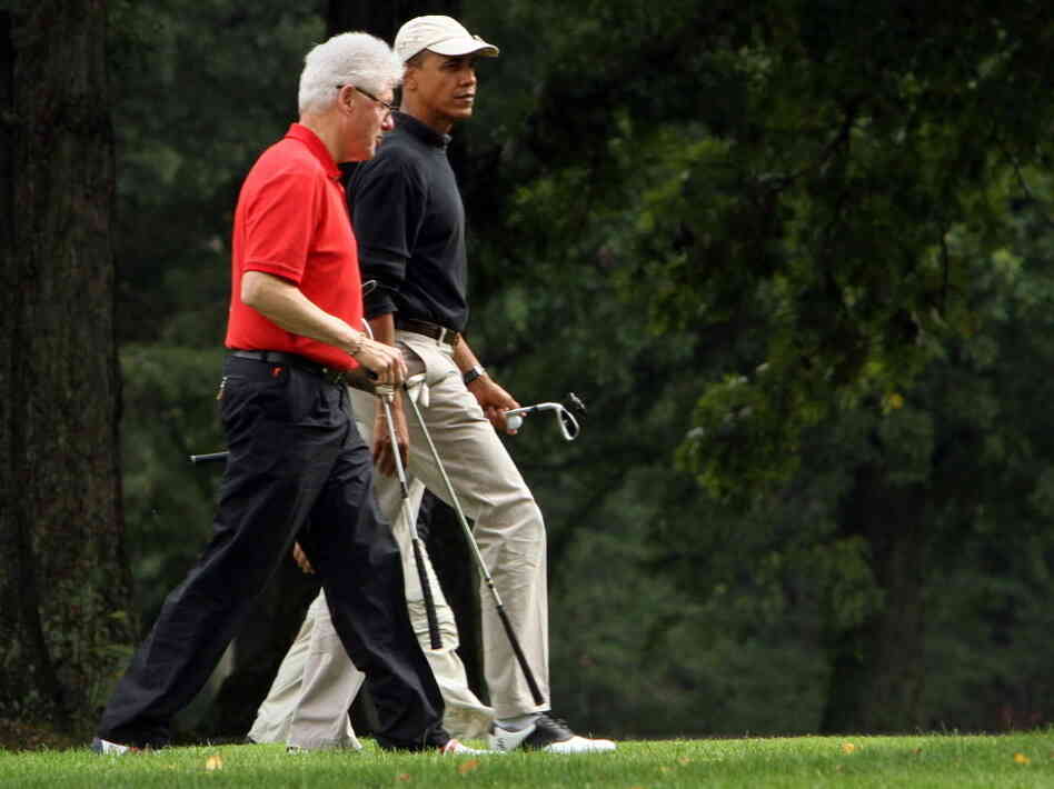 Presidents Clinton and Obama during a round of golf last September.
