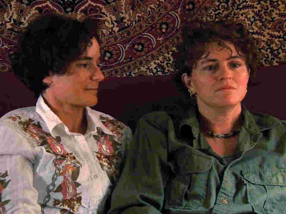 Trina McDonald (right), who was sexually assaulted while serving in the U.S. Navy, sits with her wife. McDonald is one of several victims interviewed in The Invisible War.