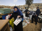 Palestinians collect their belongings after Israeli bulldozers raze their house in an Arab neighborhood in east Jerusalem on Feb. 9. Palestinians collect their belongings after Israeli bulldozers raze their house in an Arab neighborhood in east Jerusalem on Feb. 9.