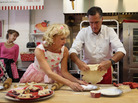 Republican presidential candidate Mitt Romney makes a pie shell with store owner Linda Hundt during a campaign stop Tuesday in DeWitt, Mich. Republican presidential candidate Mitt Romney makes a pie shell with store owner Linda Hundt during a campaign stop Tuesday in DeWitt, Mich.