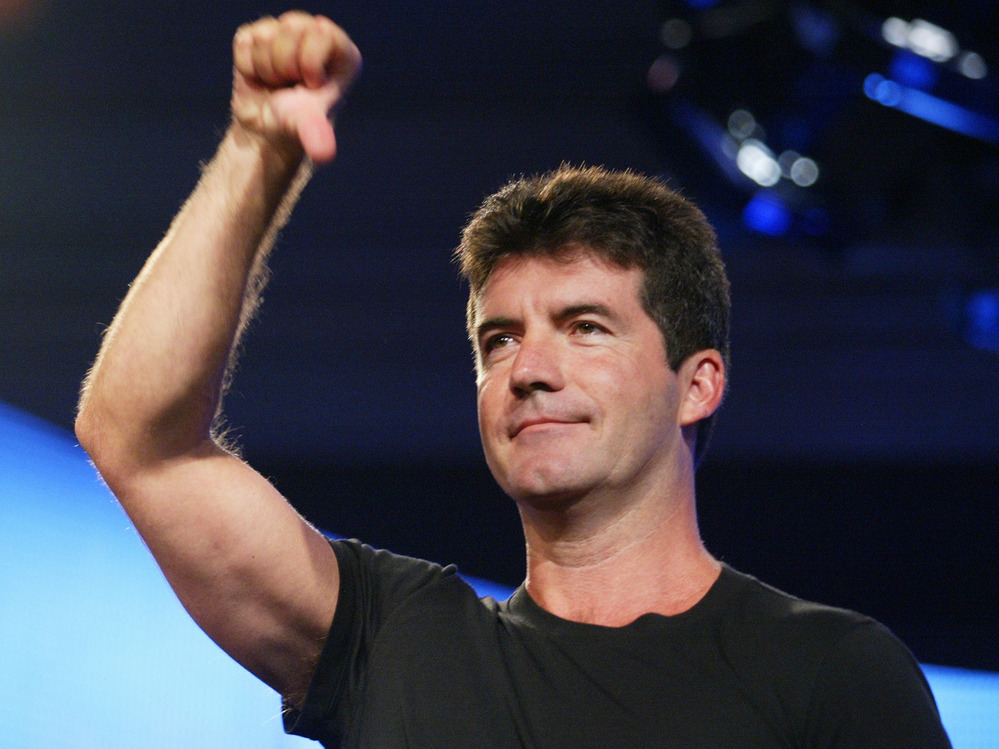 Simon Cowell in his early days as an American Idol judge. The success of Cowell and others shows that bullying is acceptable, says Eric Deggans, so long as it's done on reality TV.
