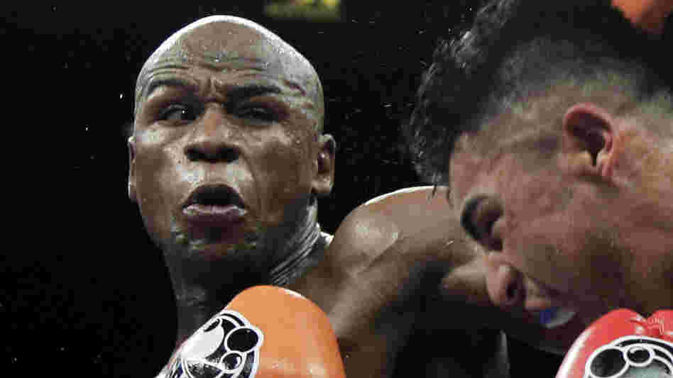 Floyd Mayweather Jr., left, punching Victor Ortiz during their WBC welterweight title fight in Las Vegas in September.