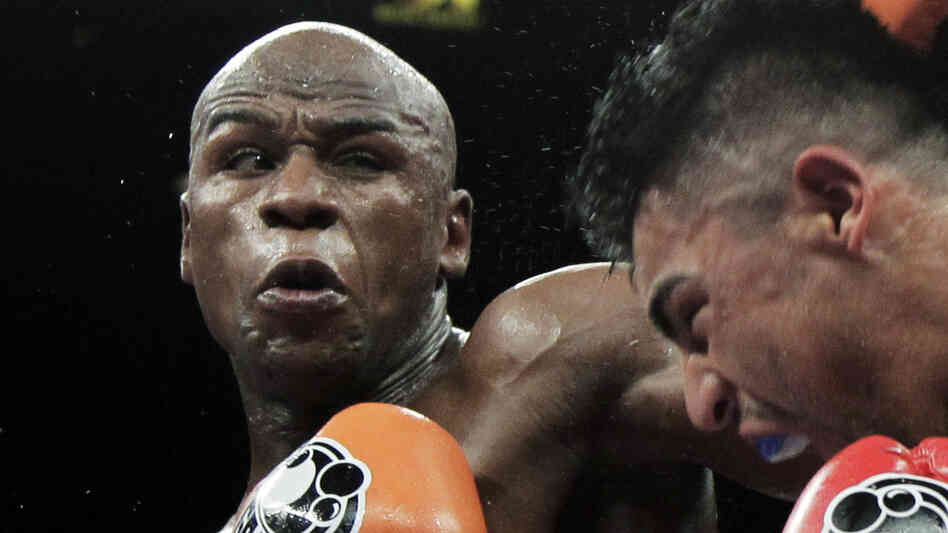 Floyd Mayweather Jr., left, punching Victor Ortiz during their WBC welterweight title fight in Las Vegas in September.