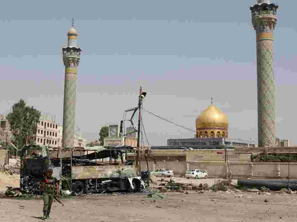 A suicide car bombing destroyed this bus outside a Shiite holy shrine in a Damascus, Syria, suburb on June 14. More than a dozen people were hurt in this attack as the violence nationwide continues to escalate.