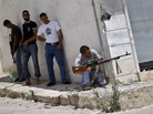 A Syrian rebel fires his weapon during clashes with Syrian troops near Idlib, in northern Syria, on June 15. The conflict has gone on for well over a year, but the international community has shown no appetite for a military intervention. A Syrian rebel fires his weapon during clashes with Syrian troops near Idlib, in northern Syria, on June 15. The conflict has gone on for well over a year, but the international community has shown no appetite for a military intervention.