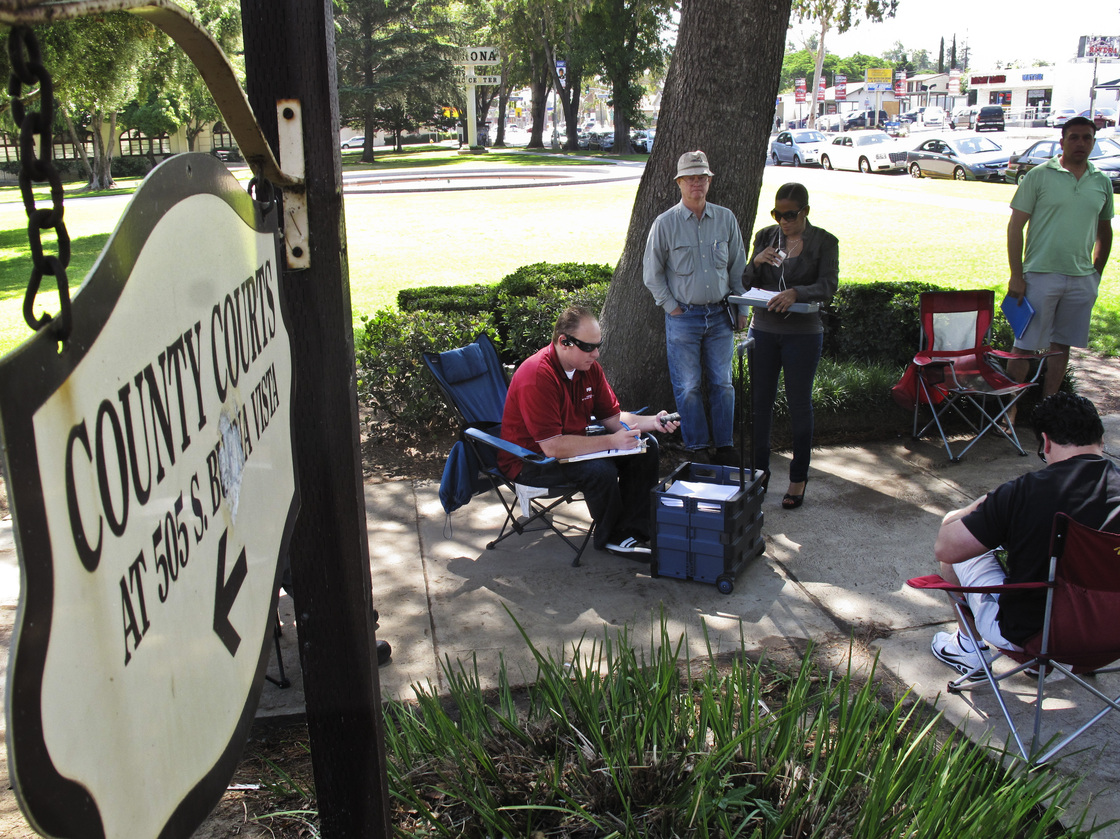 Daily auctions are held on foreclosed properties in front of the county courthouse in Corona, Calif. About 80 bidders, representing investors, show up to bid on properties.
