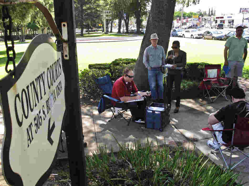 Daily auctions are held on foreclosed properties in front of the county courthouse in Corona, Calif. About 80 bidders, representing investors, show up to bid on properties.