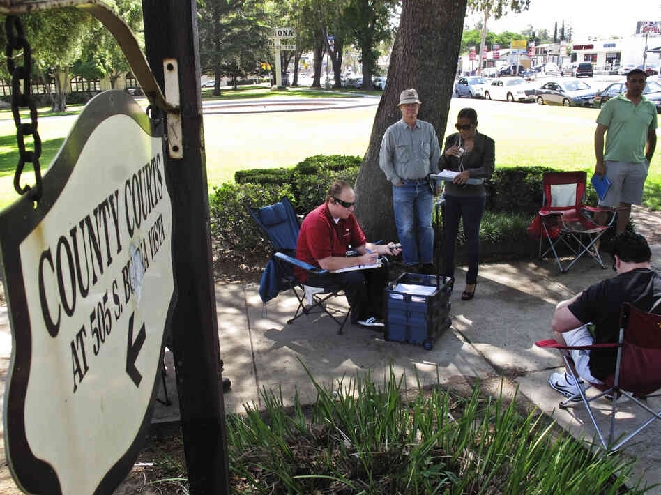 Daily auctions are held on foreclosed properties in front of the county courthouse in Corona, Calif. About 80 bidders, representing investors, show up to bid on properties.