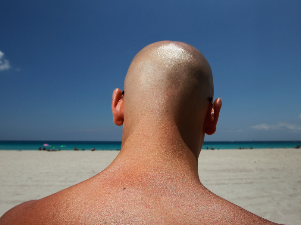 Stefano Amabili walks under the sun on the beach on May 10, 2012 in Miami Beach, Florida.