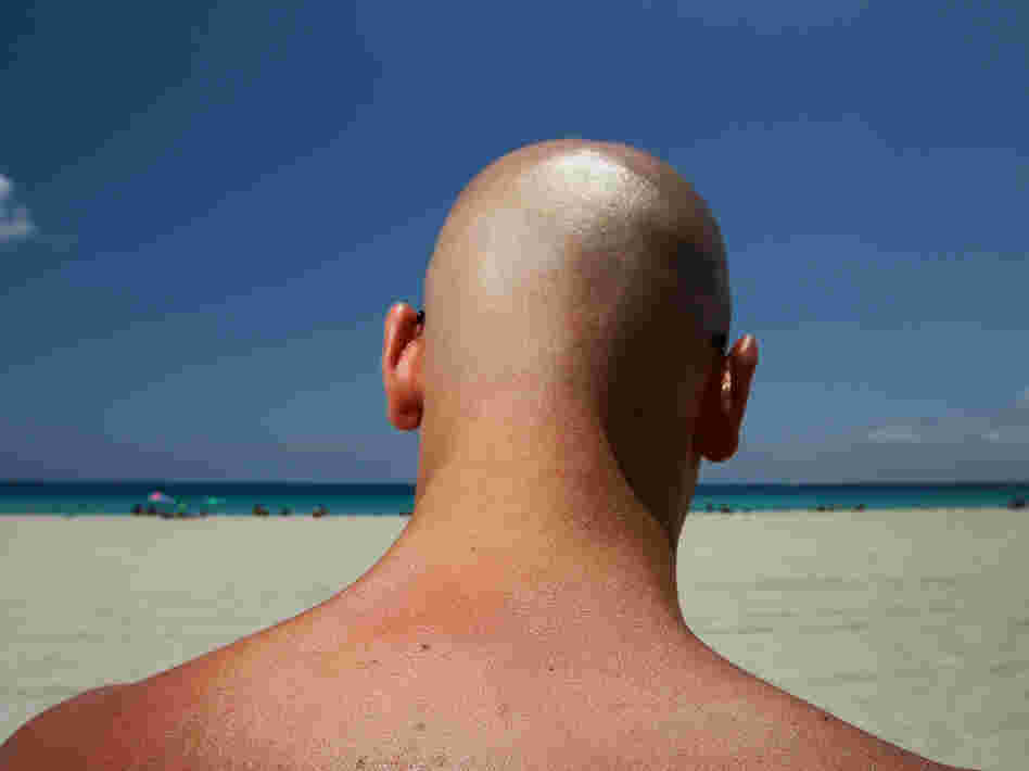 Stefano Amabili walks under the sun on the beach on May 10, 2012 in Miami Beach, Florida.