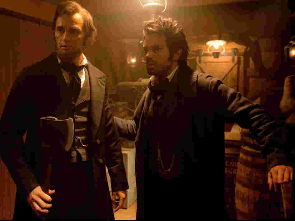 Abraham Lincoln with Henry Sturges (Dominic Cooper), a friendly member of the undead who trains Lincoln as a vampire hunter.