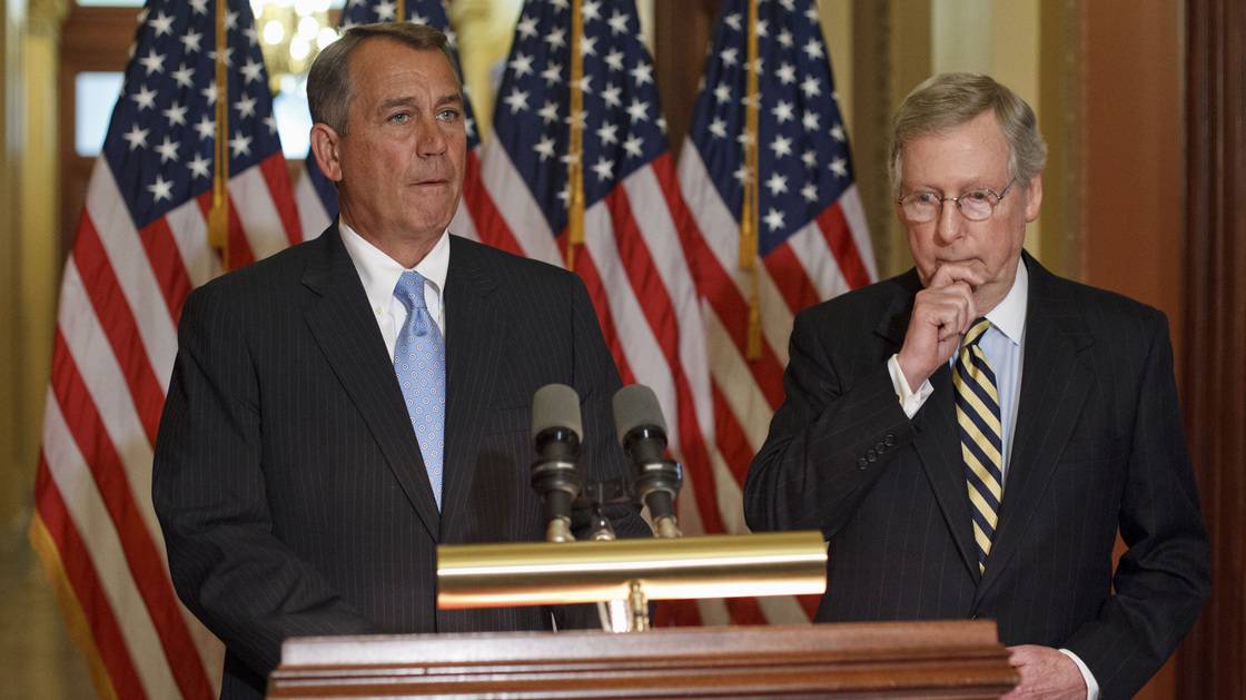 House Speaker John Boehner, R-Ohio (left) and Senate Minority Leader Mitch McConnell, R-Ky., on Capitol Hill in February. Republicans have been quick to criticize the president for bypassing Congress with his immigration action, but they've been unusually silent on the policy itself.