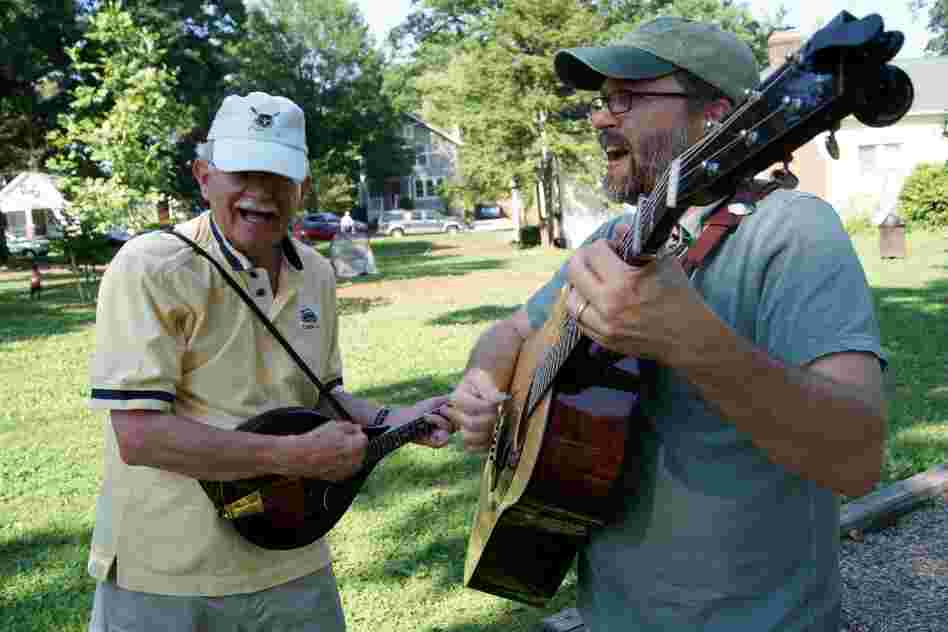 CABOMA members play guitar and mandolin.