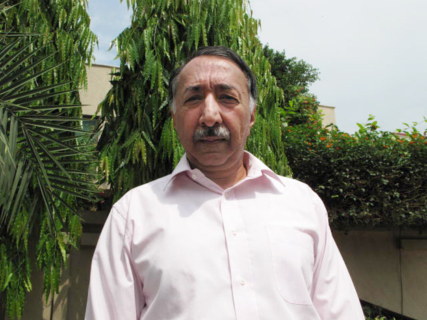 Retired senior police investigator Zafar Qureshi, 59, stands outside his home in Lahore, Pakistan, where security guards are stationed 24 hours a day. The former police official has probed some of the highest profile cases of official misconduct in Pakistan, and says he fears for his safety and that of his children in a country that he says is steeped in a "culture of corruption."
